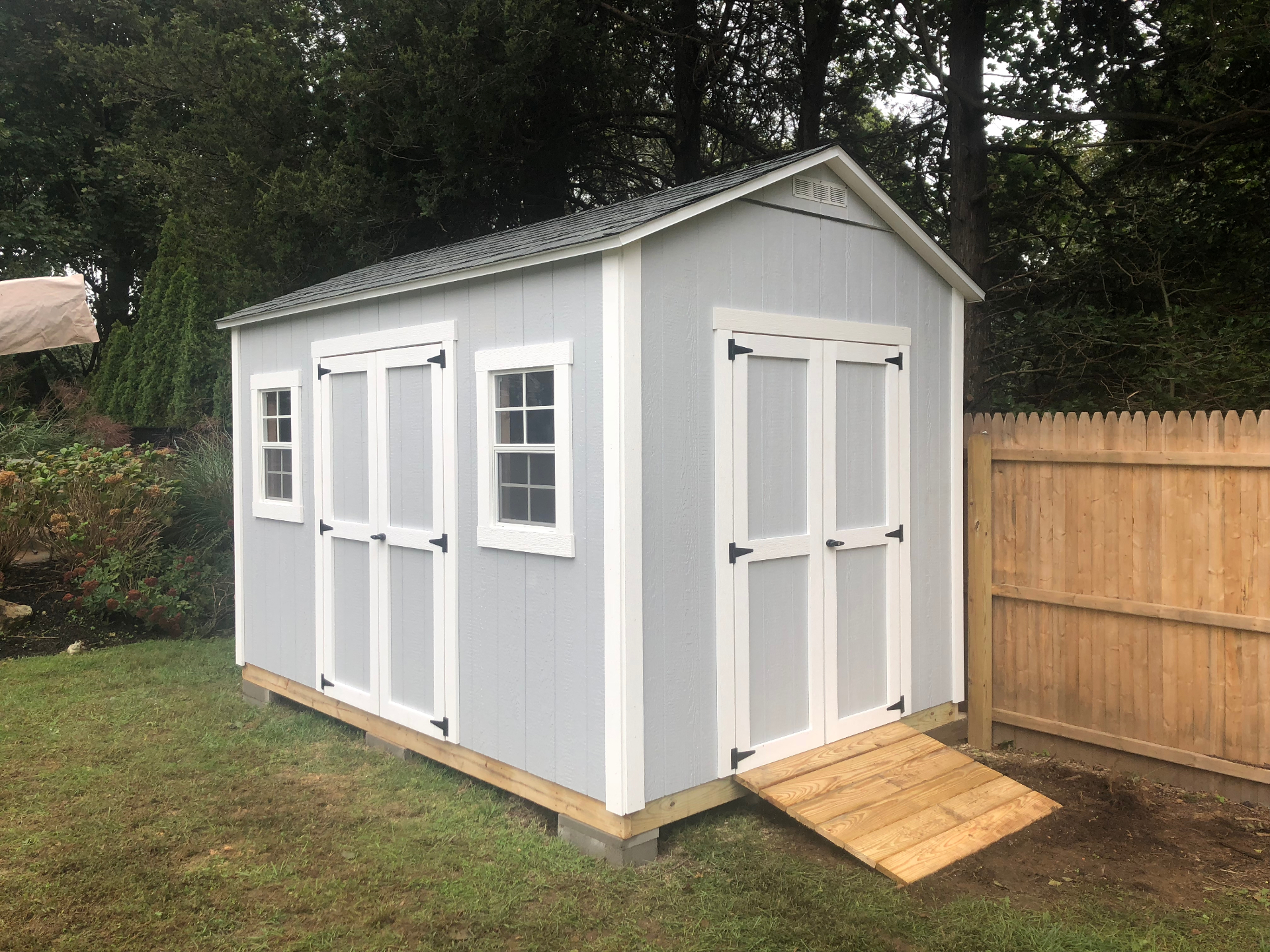 Gray garden shed with double doors