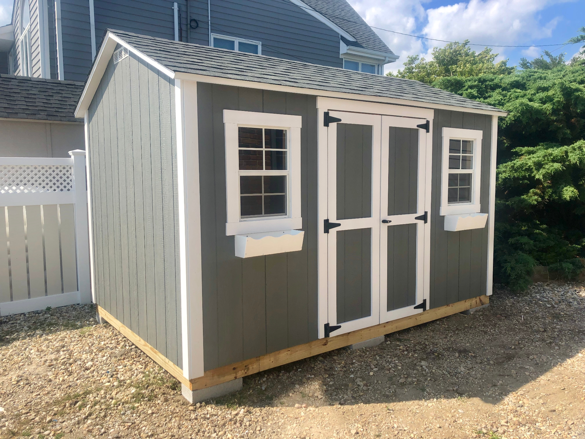 Custom gray backyard shed built on-site in New Albany, Indiana